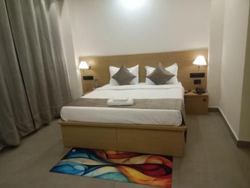 a bedroom with a bed and a rug on the floor at The Vista Retreat in Shimla