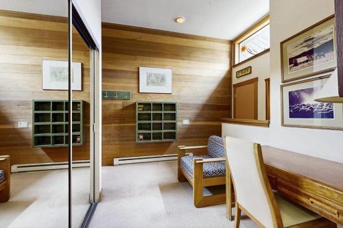 a room with wooden walls and a table and chairs at Sun Valley Sun Snowcreek in Sun Valley