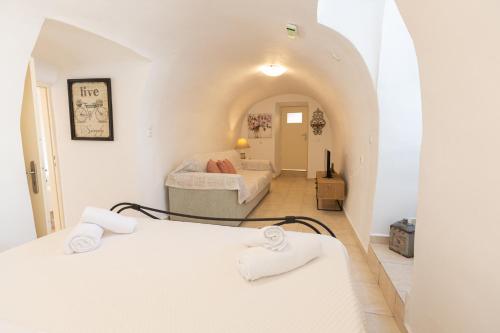 a room with two beds and a hallway at Archontiko Koufantonis in Kotronas