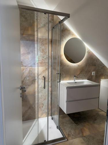 a bathroom with a sink and a shower at Casa Chatelain in Ronco sopra Ascona