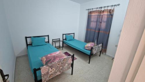 an overhead view of a bedroom with two beds at Menzel Rayan in Midoun