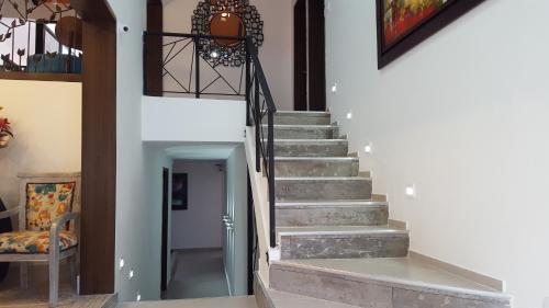 a stairway in a home with a stair case at Rivière Boutique Hotel in Medellín