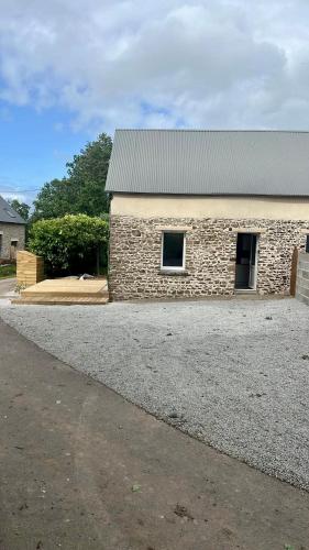 a stone building with a window on the side of it at Cozy studio in Millières