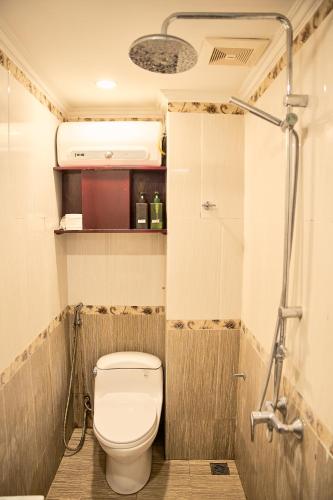 a small bathroom with a toilet and a shower at Ha Noi Capital Boutique Hotel in Hanoi