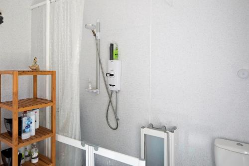 a shower in a bathroom with a toilet at Cenotaph View, Bardon Mill in Hexham