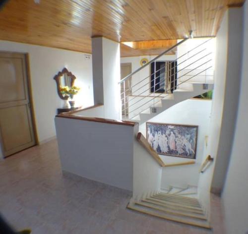 a staircase in a house with a stair case at Hotel Center in Ibagué