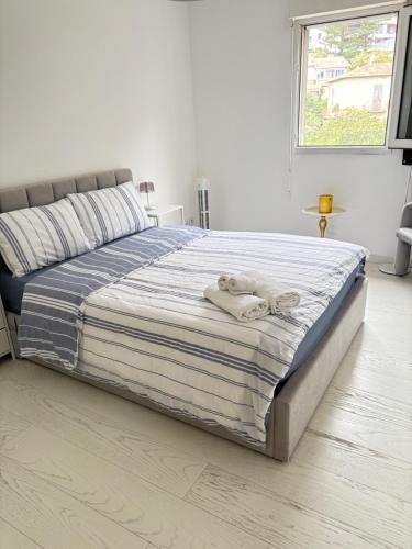 a bedroom with a bed with towels on it at New,mountain & sea view 3 guests with private Garage in Beausoleil