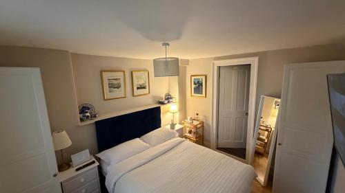 a bedroom with a bed with a white bedspread at Georgian House Boutique B&B in Edinburgh