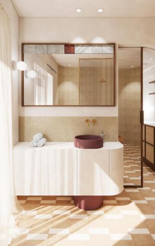 a bathroom with a tub with a mirror and a sink at Noemia Skiathos in Skiathos