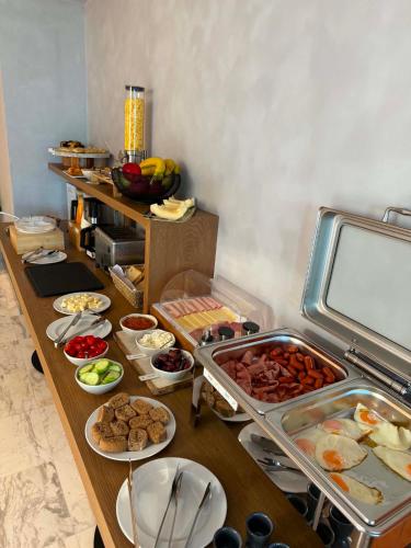 a buffet with many different types of food on a table at Theta Boutique Hotel in Chania