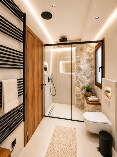a bathroom with a shower and a toilet at Aje Villas 1959 in Ioannina