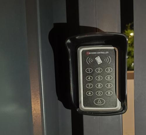 a cell phone is attached to a door at Dolce Luna in Isola Sacra