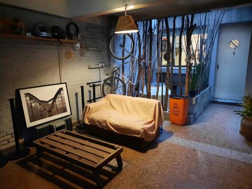 a living room with a couch and a bench at LodelaAbuela 2 in Ciudadela
