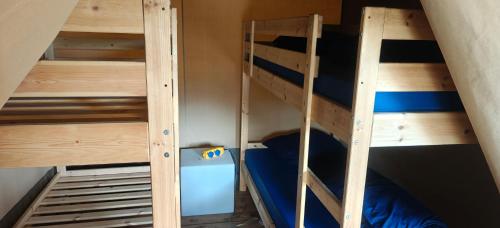 a bunk bed in a room with two bunk beds at Camping Amable in Someren
