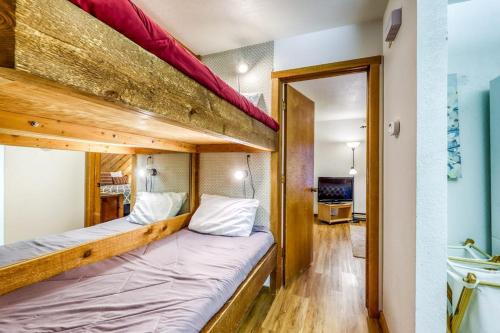 two bunk beds in a room with a bathroom at Ridge Hideaway in Sun Valley