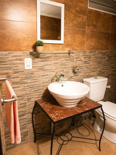 a bathroom with a sink and a toilet at Panambí in Colón