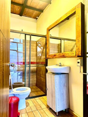 a bathroom with a sink and a toilet at Finca Dulce Amanecer in Villeta