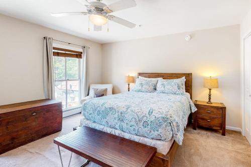 a bedroom with a bed and a ceiling fan at Heavenly Hideaway in Ludlow