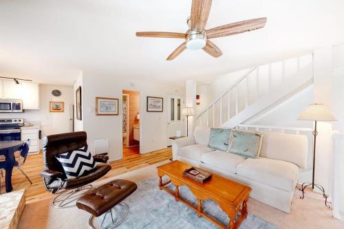 a living room with a white couch and a ceiling fan at Valley Gem Upper in Sun Valley