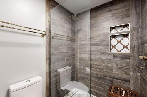 a bathroom with a toilet and a glass shower at Sun Valley Serenity in Sun Valley