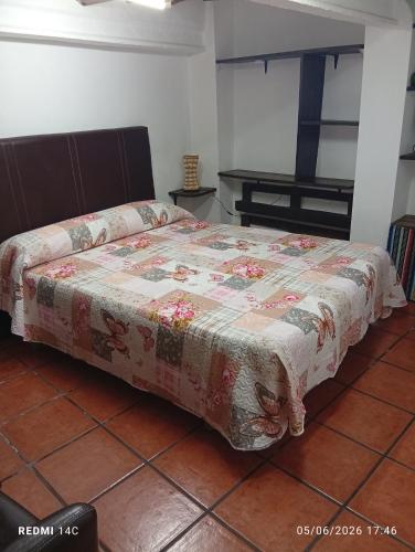 a bedroom with a bed with a blanket on it at Can Mari in Ayna