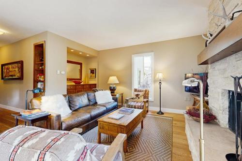 a living room with a couch and a fireplace at Among the Wildflowers in Sun Valley