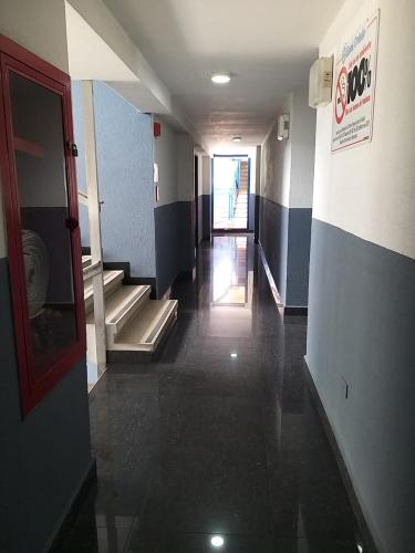 an empty hallway with stairs in a building at Oviedo Hotel R in Mérida