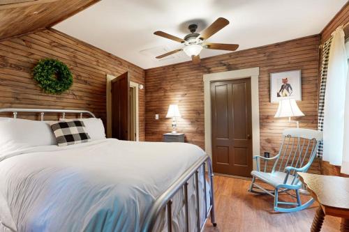 a bedroom with a bed and a ceiling fan at The Mitchell House in North Woodstock
