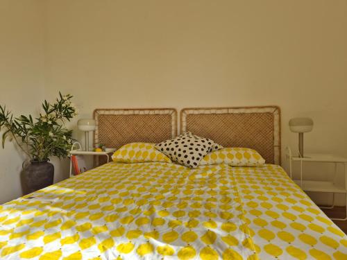 a bedroom with a bed with lemons on it at Otto Novalja, spacious penthouse apartment in city center in Novalja