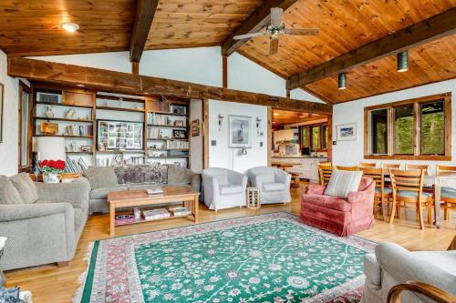 a living room with a couch and a table at Beebe Lake House in Castleton