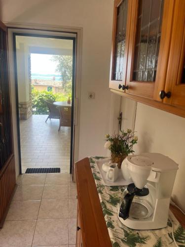 a kitchen counter with a blender on top of it at Eden apartments 2 in Bardolino