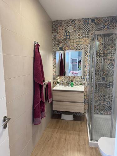 a bathroom with a sink and a mirror at La Estrella del Sur in Adeje