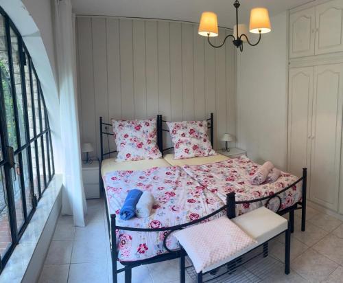 a bedroom with a bed with pink sheets and pillows at Eden apartments 2 in Bardolino