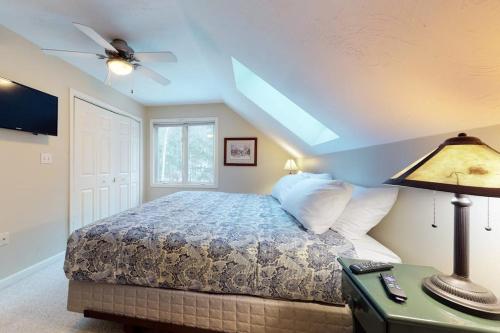 a bedroom with a bed and a ceiling fan at The Ski Haus in Jackson