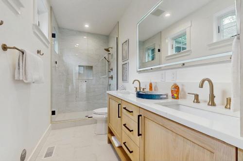 a bathroom with a sink and a shower and a toilet at StillWater Retreat in Dover