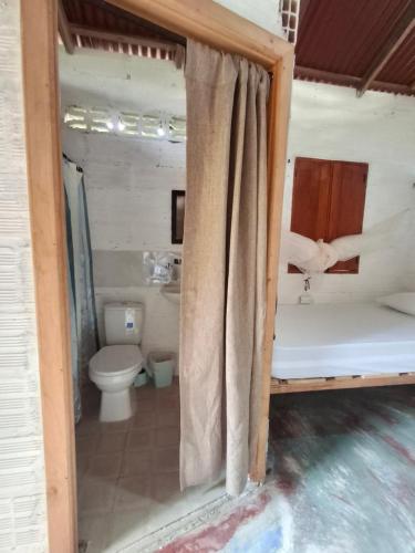 a bathroom with a tub and a toilet in a room at BlueBayou.capurgana in Capurganá