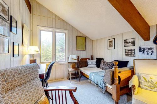 a living room with a bed and a couch at Rustic Escape in Franconia