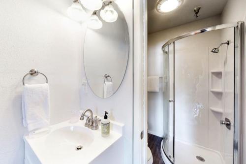 a white bathroom with a sink and a shower at Elkhorn Escape in Sun Valley