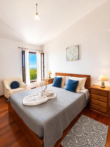 a bedroom with a bed with a towel on it at Dr. Cabral Barreto in Ponta do Sol