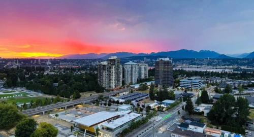 an aerial view of a city at sunset at Cozy private bedroom and bathroom in Surrey