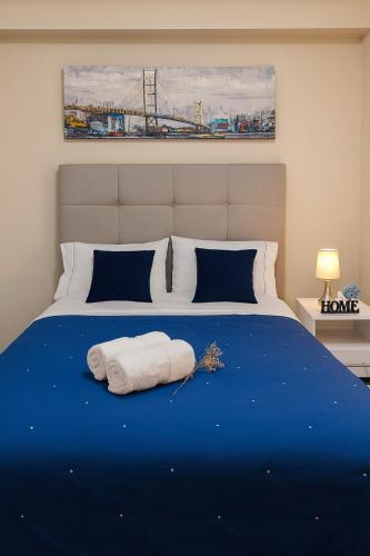 a bedroom with a bed with a white towel on it at Room in shared apartment - Shared Bathroom 402 in Lima