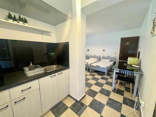 a kitchen with a sink and a counter top at Koala Place in Vasiliki