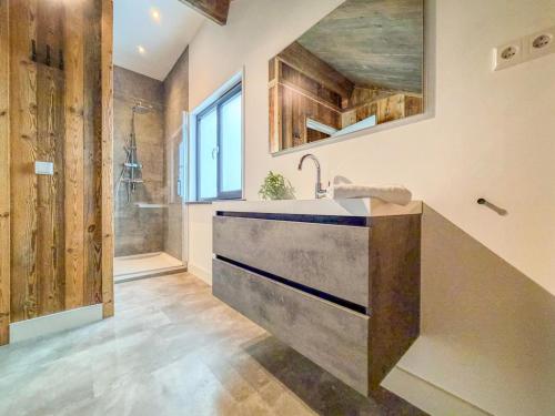 a bathroom with a sink and a shower at Alpenzeit Afritz am See in Afritz