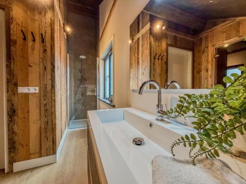 a bathroom with a large sink and a shower at Nockberge in Afritz