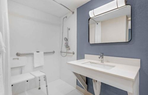 a bathroom with a sink and a mirror at Extended Stay America Select Suites - Longview in Longview