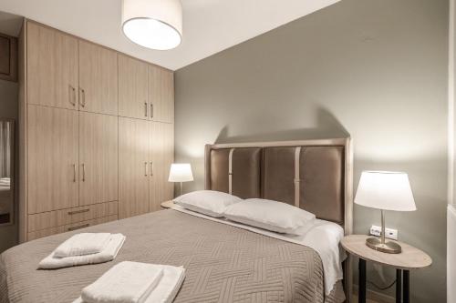 เตียงในห้องที่ Volos Comfort Space