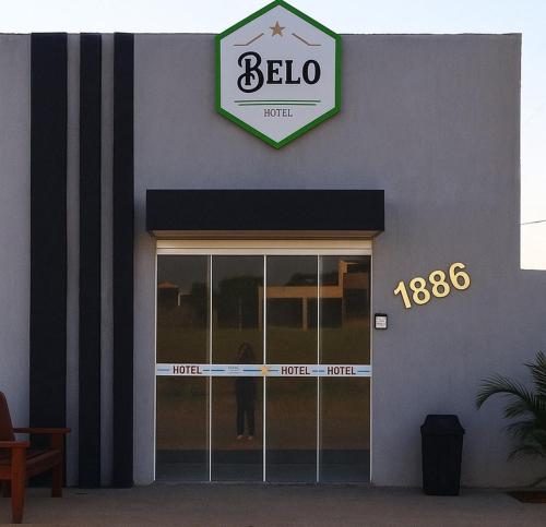 a bella store front with a sign above the door at Belo Hotel in Ribas do Rio Pardo