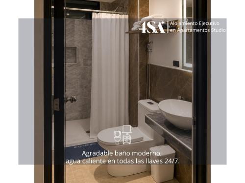 a bathroom with a toilet and a sink at 4StudioAparts RC 04 in Cajamarca