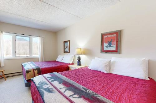 a hotel room with two beds and a window at Autumn Colors Condo, Unit 215 in Lincoln