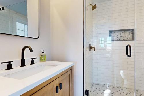 a bathroom with a sink and a shower at Mountain Sunset Villa in Waterville Valley